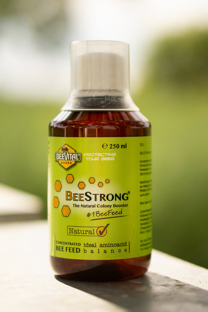 beestorng bottle close ups on mashed background