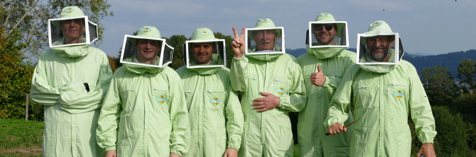 6 beekeepers posing for a camera shot happily